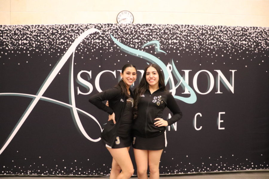 Maya Garcia and Giselle Gonzalez pose in front of the Ascension banner. 