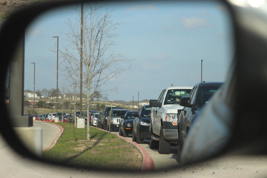The long lines of traffic linger in the parking lot a half hour after the bell.