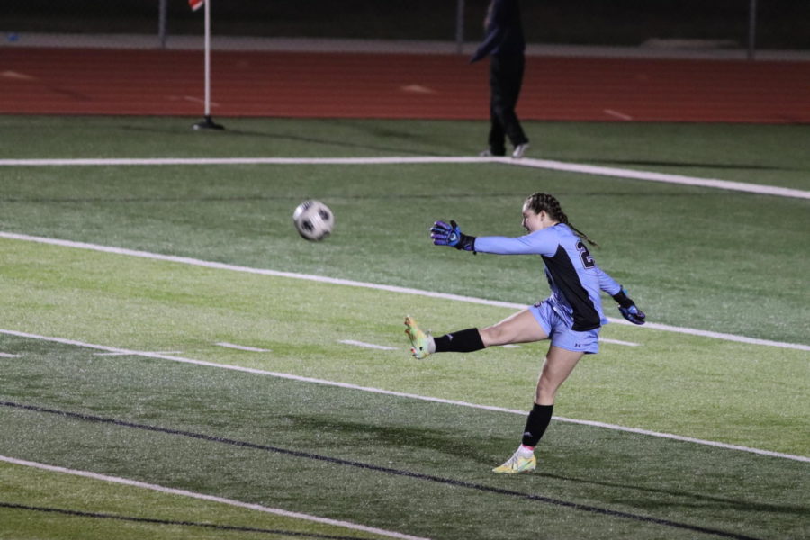 Sophomore Maddie Coats, one of the teams goalkeepers, sends the ball back to a member of her team.  