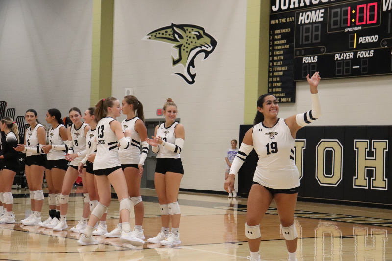 Senior Setter Alyssa Vega waving to the student section before the game against Bowie. 