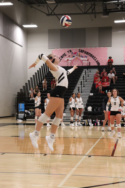 Setter Macy Philips serving the ball. 