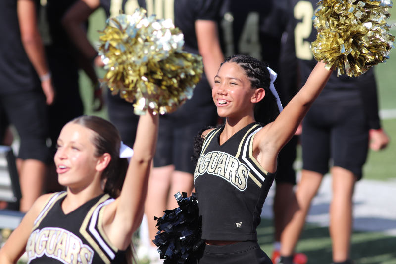 JV cheerleader Jayda Borget rooting towards the crowd. 