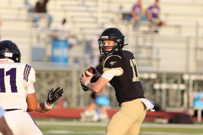 JV Black team quarterback Chase Gregory scouting the field. 