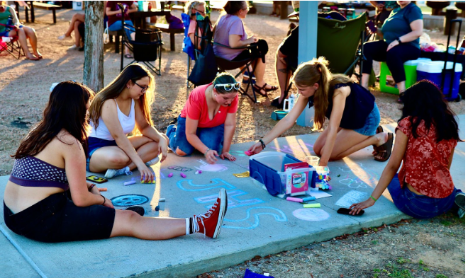 Drawn to JHS: Libby Phillips, Kylie Bowlin, Kylie Miller, Avery Humphries, and Jenya Ratanjee draw with chalk at the Back to School Bash on Aug. 17 at the Buda City Park.