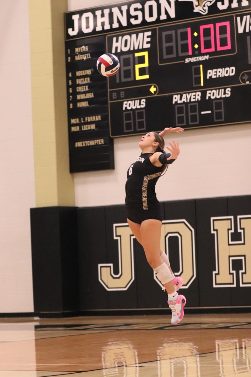 Sophomore Zoe Richardson serves the ball.