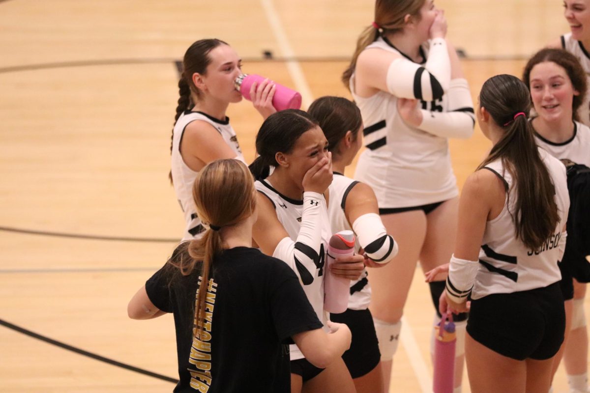 Senior Zaniah Hoskins filled with shock after winning the 3rd set against San Marcos. 