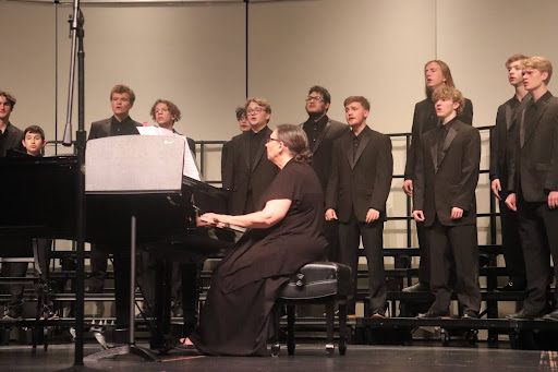 The tenor/bass choir rehearsing before the concert at the Hays Performing Arts Center with pianist Karen Dunn.
