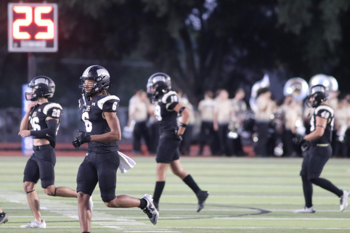 Johnson football players running during the football game on Sep. 27. 