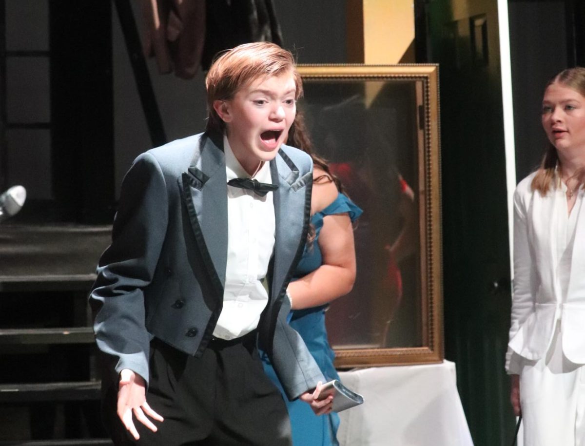 Junior Jasper Schiesoer performing as the character Wadsworth during the theatre's Clue performance. 