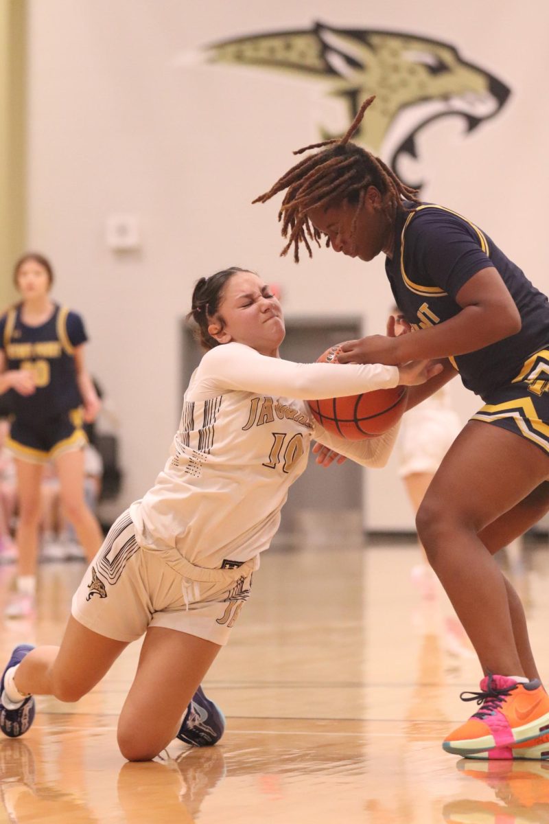 Stealing to Win 
Sophomore Aundrea Garcia attempting to steal the ball from her opponent. The efforts made by Garcia and her teammates would help them make the win. "It was pretty instense," Garcia said. "I was feeling like we got to win the game."