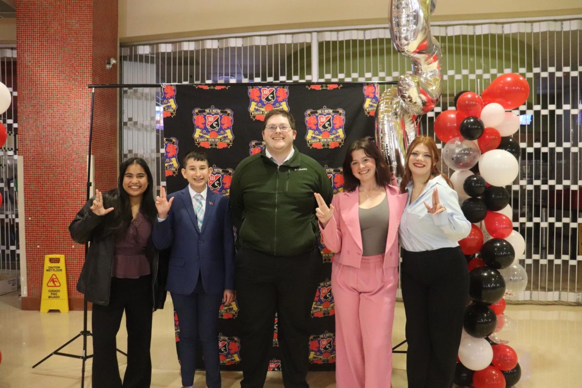 [left] Daniella Moreno, Nikolas Morante, Michael Harris, Addison Petrea, Emma Wagner [right] at Churchill High School for a debate tournament on Jan. 11. 