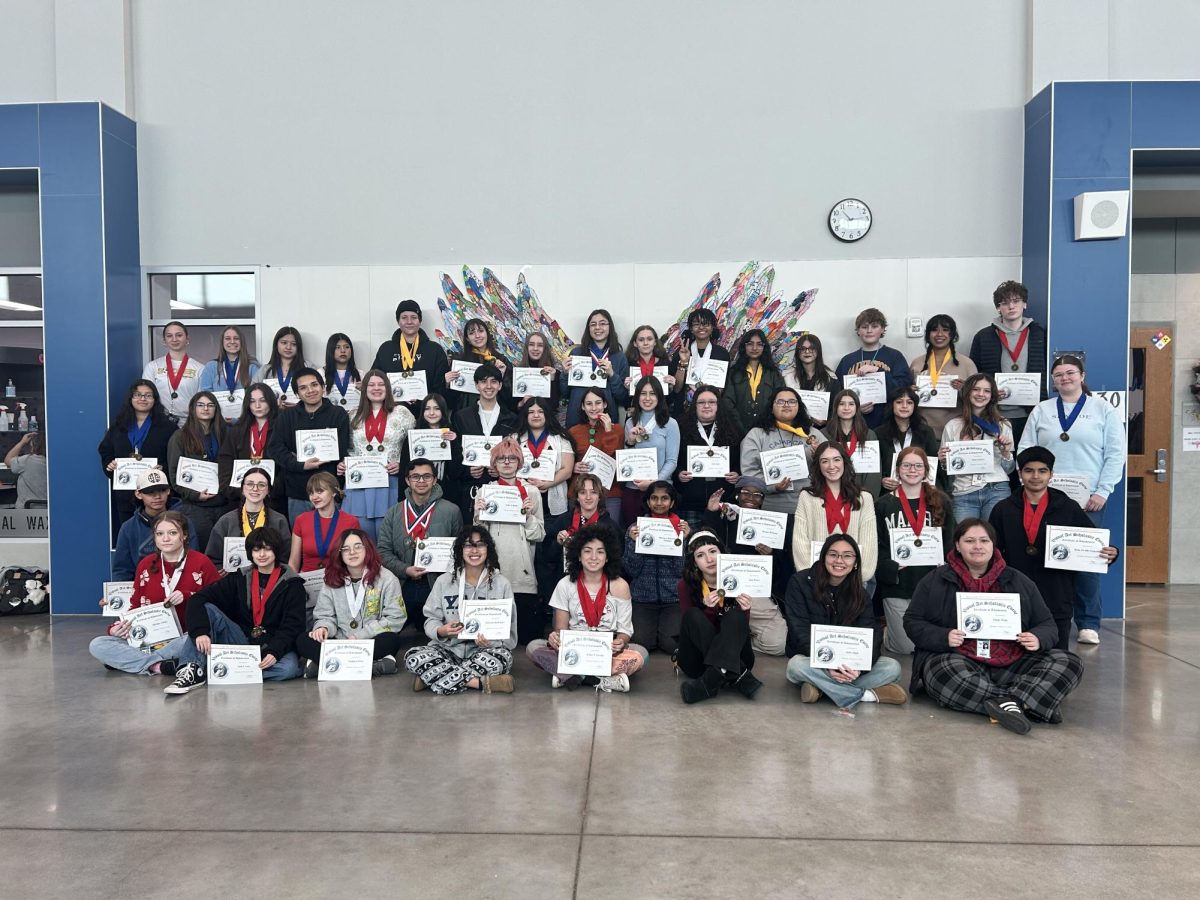 Art students pose for the picture with participation certificates from the VASE competition. 